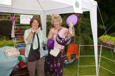 The Choir Handbag Raffle - Elizabeth Strachan & Alison O'Brien present some of the selection. [image by DM Phillips]