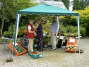 Marie McDonald, Alison & Jim O'Brien setting up the Plant & Produce stall. 