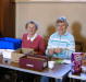 Jean McPherson & Chris Peacock man the raffle stall.